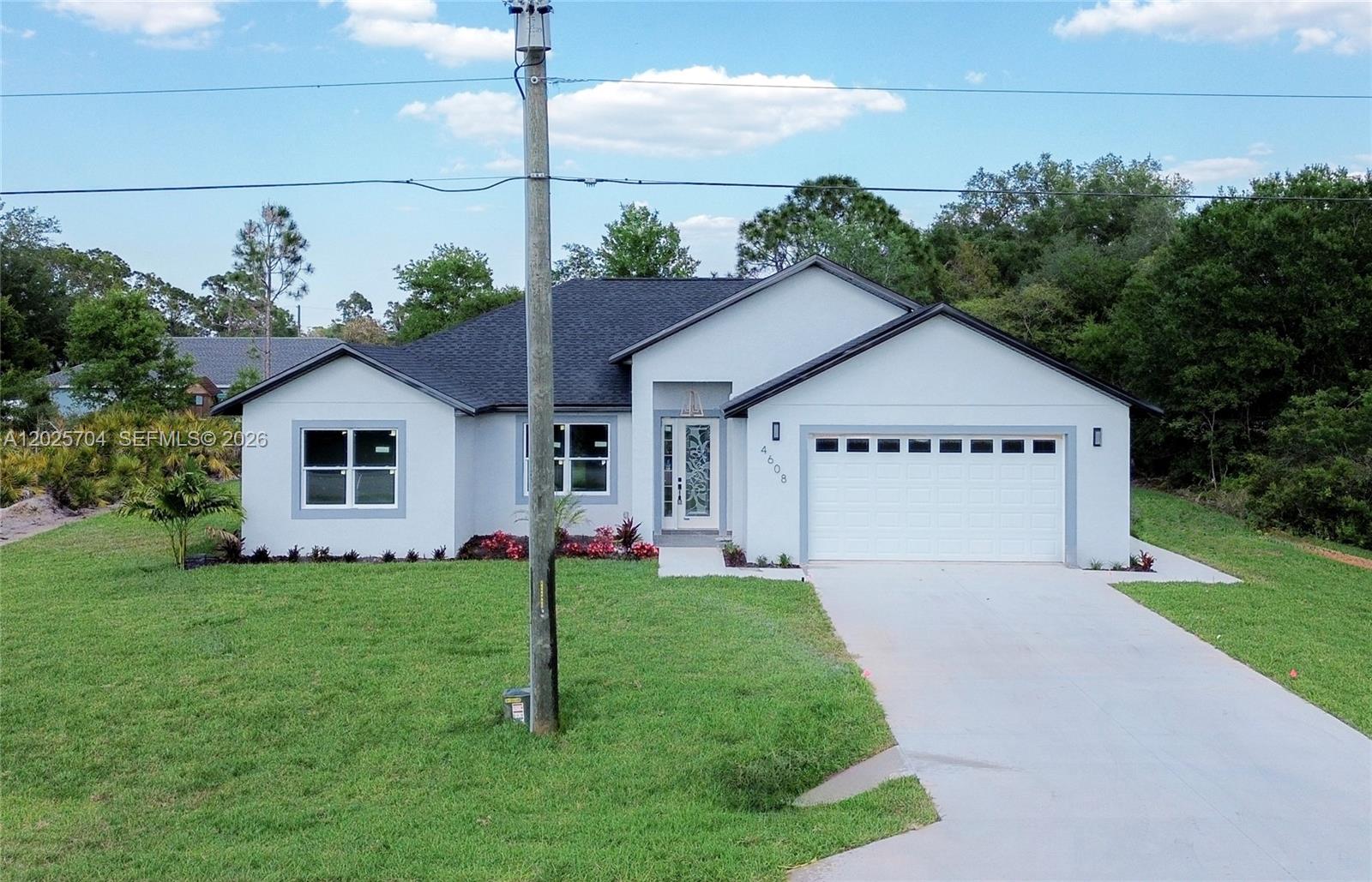 A walk-in closet features white shelving units, built-in drawers, and metal clothing rods — 4608 CORTEZ BLVD, Sebring FL 33872, SEBRING, FL