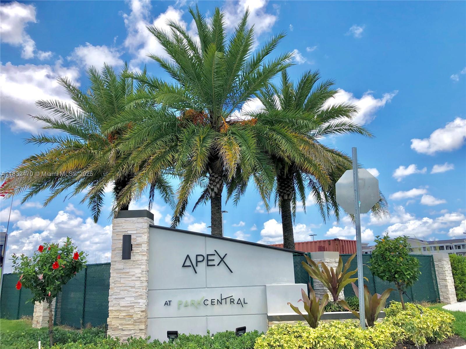 A sign for Apex at Park Central stands in front of palm trees and a fence — 8031 NW 104th Ave # 21, Doral FL 33178, DORAL, FL