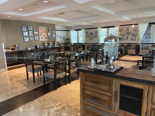 A dining room features multiple tables, chairs, a beverage dispenser, and framed wall art — 5300 NW 87th Ave # 316, Doral FL 33178, DORAL, FL