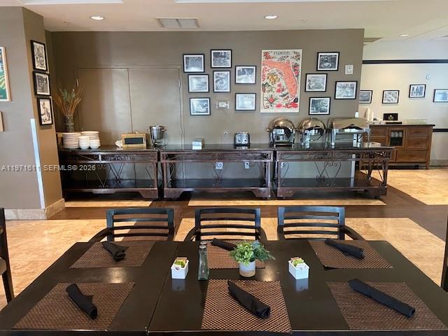 A dining room features a long buffet counter with chafing dishes and a gallery wall — 5300 NW 87th Ave # 316, Doral FL 33178, DORAL, FL