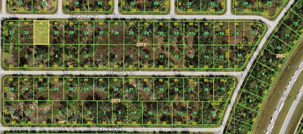 This is a satellite map showing a grid of undeveloped residential land lots — 14431 CORAL SEA AVENUE, PORT CHARLOTTE, FL
