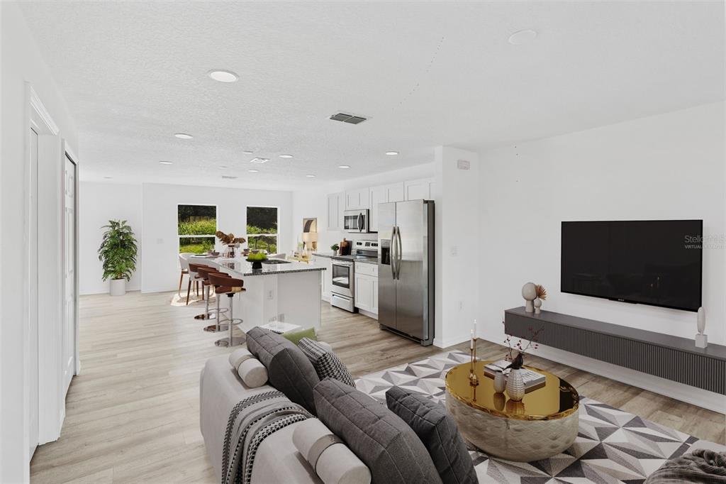 This is a virtual rendering of an open-concept living room and kitchen with modern finishes — 172 BOWIE LANE UNIT B, KISSIMMEE, FL