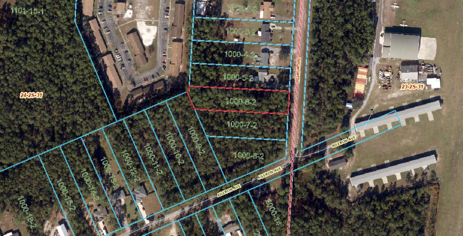 This is an aerial map showing property parcel boundaries overlaid on a wooded landscape — 9897 Aileron Avenue, FL 32506, FL