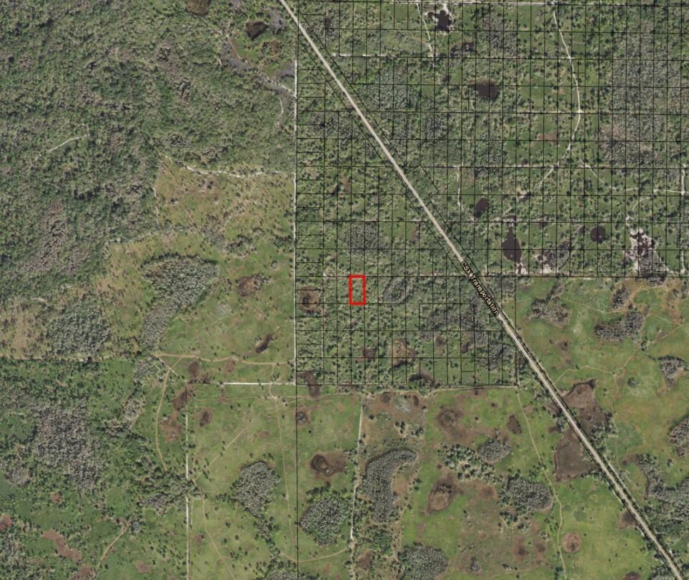 An aerial map view shows a small red-outlined parcel of land near a railroad track — 0 County Rd 54, FL 33849, FL
