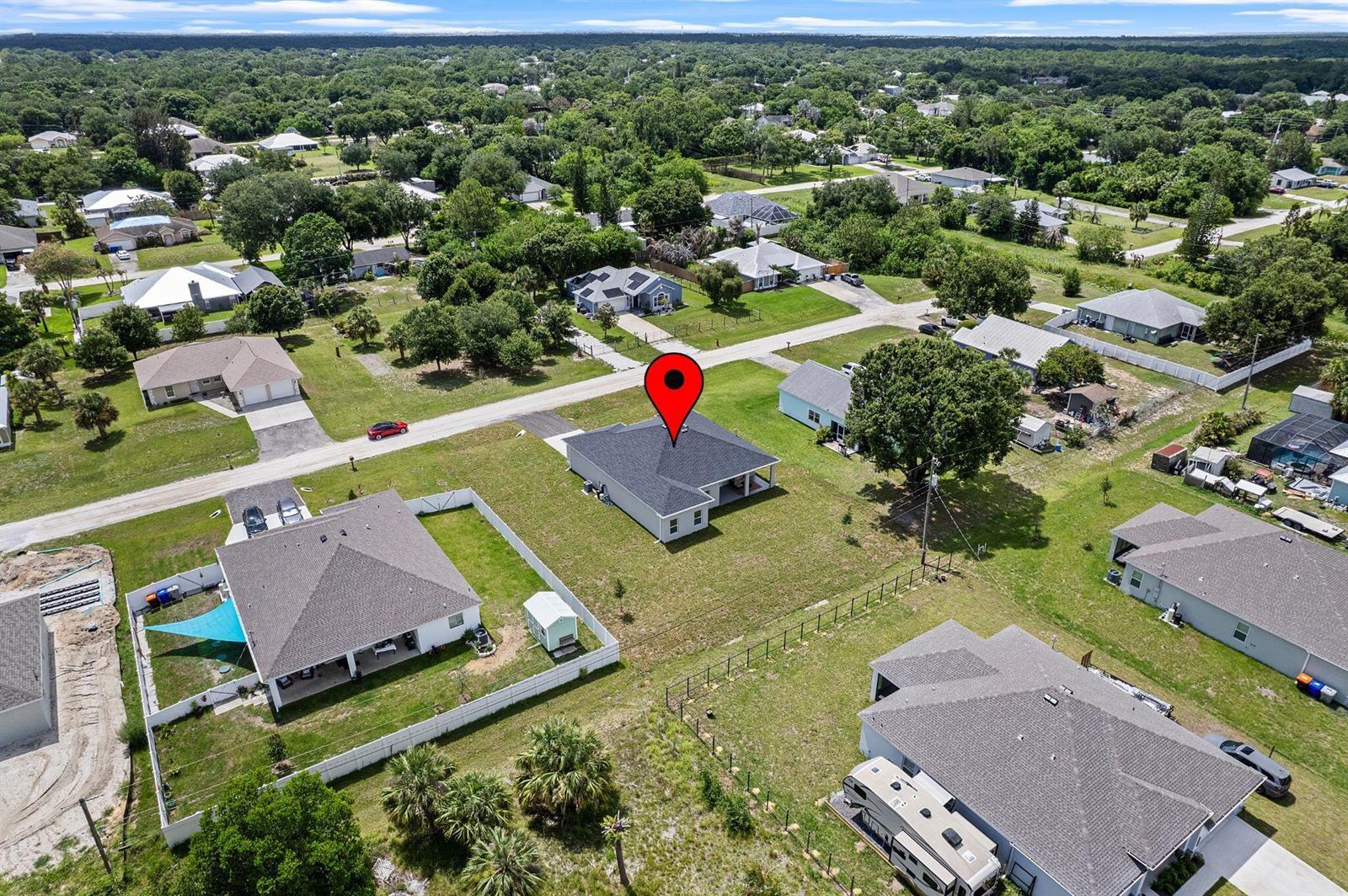 An aerial view shows a single-story house with a dark roof and a red location pin — 8536 96th Court, Vero Beach FL 32967, VERO BEACH, FL