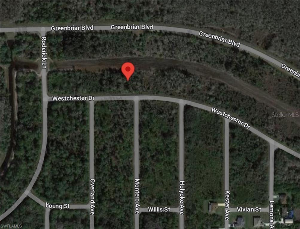 This is a satellite map view showing a vacant lot marked with a red pin — 486 WESTCHESTER DRIVE, LEHIGH ACRES, FL