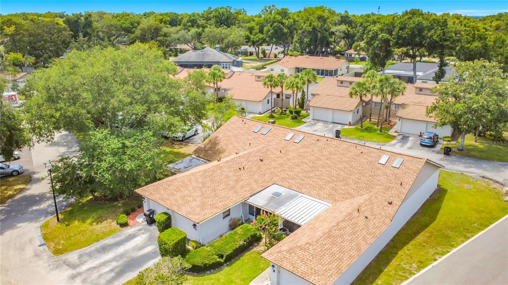 A kitchen features gray cabinets, white appliances, a marble-patterned countertop, and blue-and-white checkered flooring — 1423 OAK PLACE UNIT B, APOPKA, FL