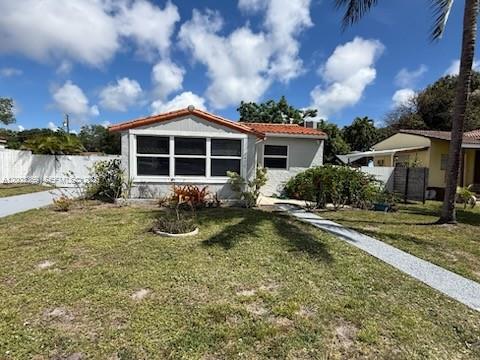 A single-story house with a white exterior, a tiled roof, and a front walkway — 2471 Dewey St, Hollywood FL 33020, HOLLYWOOD, FL