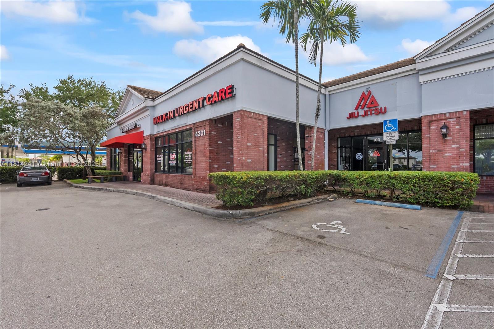 An exterior view of a commercial building featuring a walk-in urgent care and a jiu-jitsu studio — 4301 S Flamingo Rd, Davie FL 33330, DAVIE, FL