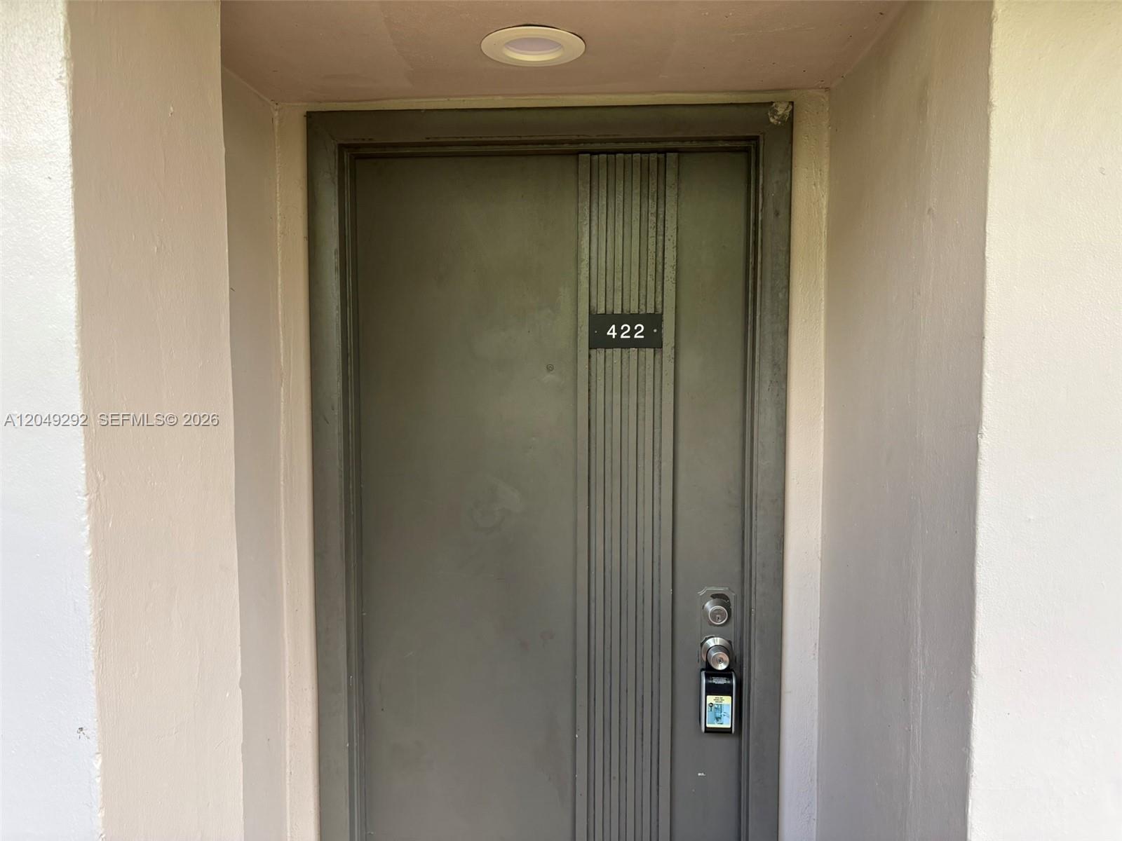 A gray apartment door with the number 422 is set within a recessed entryway — 8500 SW 133rd Ave Rd # 422, Miami FL 33183, MIAMI, FL