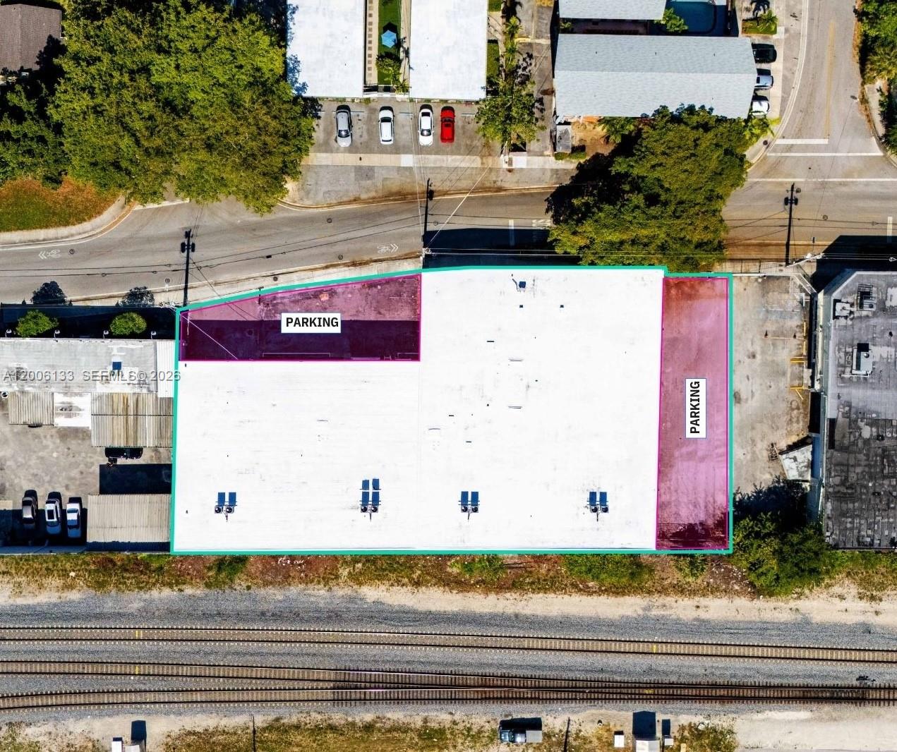An aerial view shows a commercial building with highlighted parking areas and adjacent railroad tracks — 6800 NE 4th Ct, Miami FL 33138, MIAMI, FL