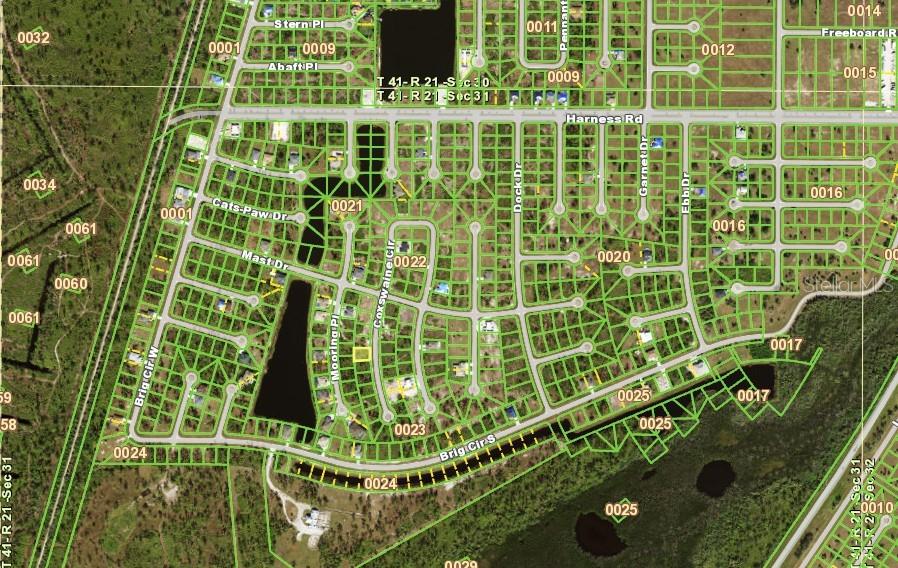 This is an aerial map showing a residential subdivision with streets, lots, and small lakes — 16 COXSWAIN CIRCLE, PLACIDA, FL