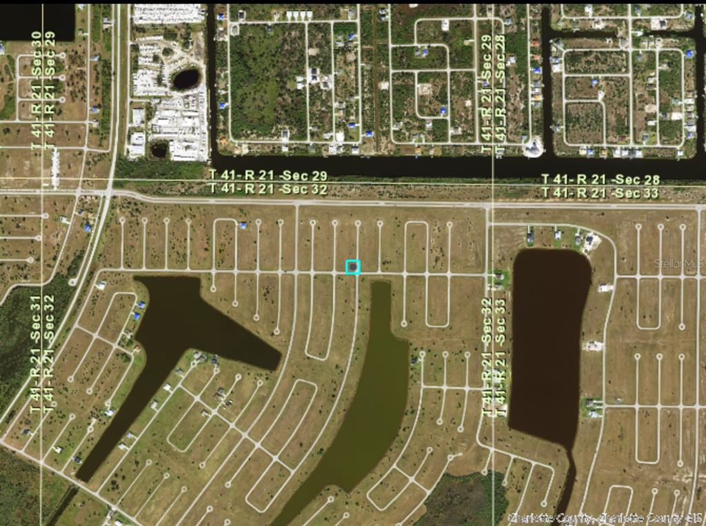 An aerial map shows a highlighted vacant residential lot situated near a canal and pond — 1 OAK COURT, PLACIDA, FL