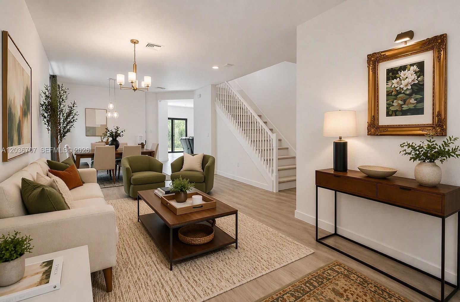 A living room features a beige sofa, three green armchairs, and a wooden coffee table — 20900 NE 2nd Ct, Miami FL 33179, MIAMI, FL