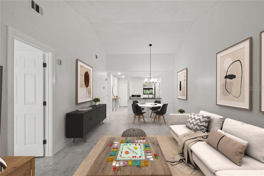 This is a virtually staged living and dining area with light walls and tile flooring — 7828 NIAGARA AVENUE UNIT 322, TAMPA, FL