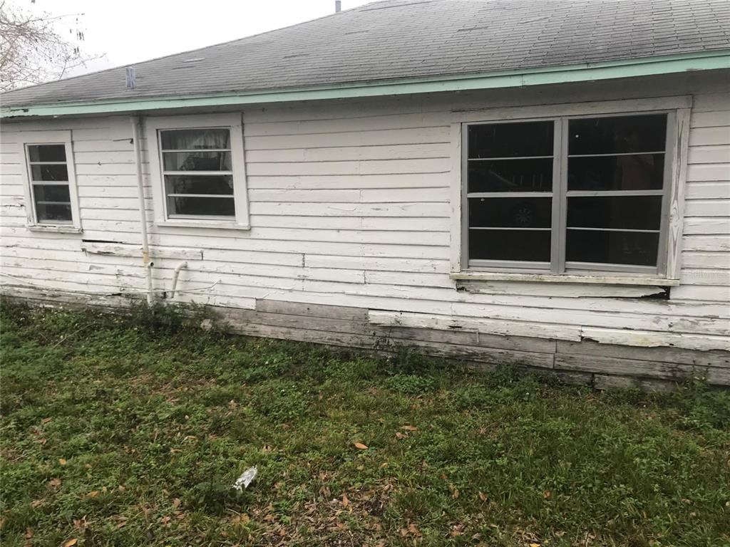 The exterior of a house with white horizontal wood siding and several windows — 2340 BROADWAY STREET, SANFORD, FL