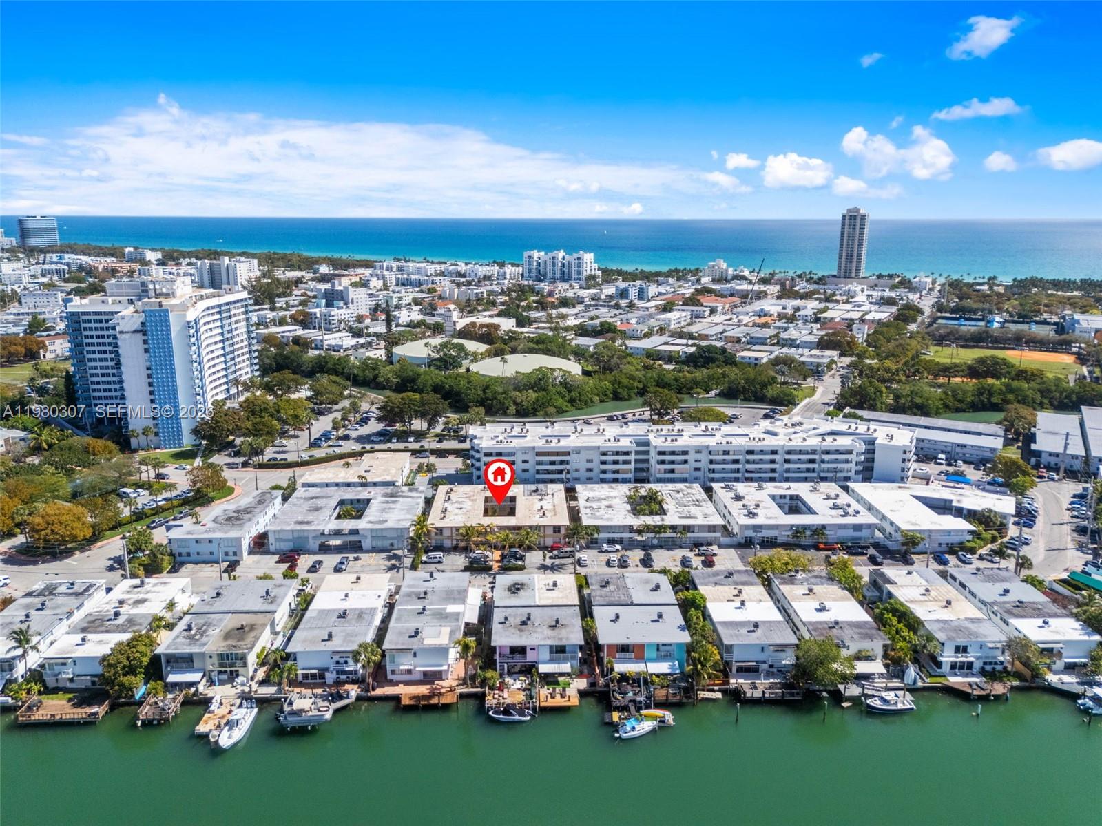 This is an aerial view of a waterfront residential complex with a red location pin — 7331 Gary Ave # 206, Miami Beach FL 33141, MIAMI BEACH, FL