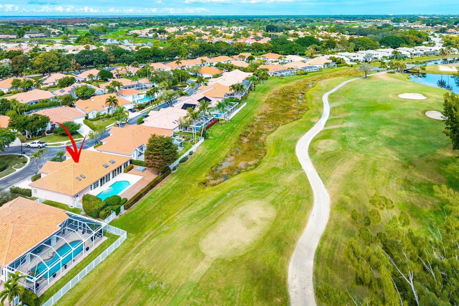 An aerial view shows a residential house with a swimming pool overlooking a golf course — 230 Eagleton Estate Boulevard, Palm Beach Gardens FL 33418, PALM BEACH GARDENS, FL