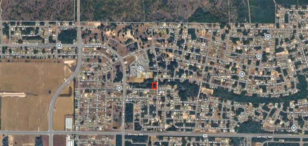 This is an aerial map view showing a highlighted property lot near a school — LOT 20 SW 132ND STREET, OCALA, FL
