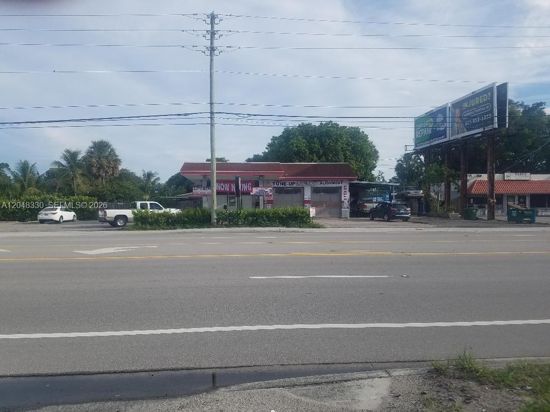 An auto repair shop with a large billboard stands along a multi-lane road — 3750 N 10th Ave N, Palm Springs FL 33461, PALM SPRINGS, FL