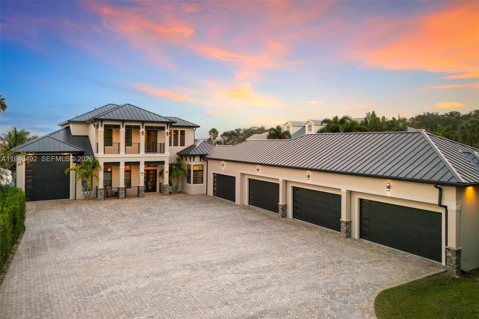 A large two-story house with a metal roof and a four-car garage — 6275 N Highway 1, Melbourne FL 32940, MELBOURNE, FL