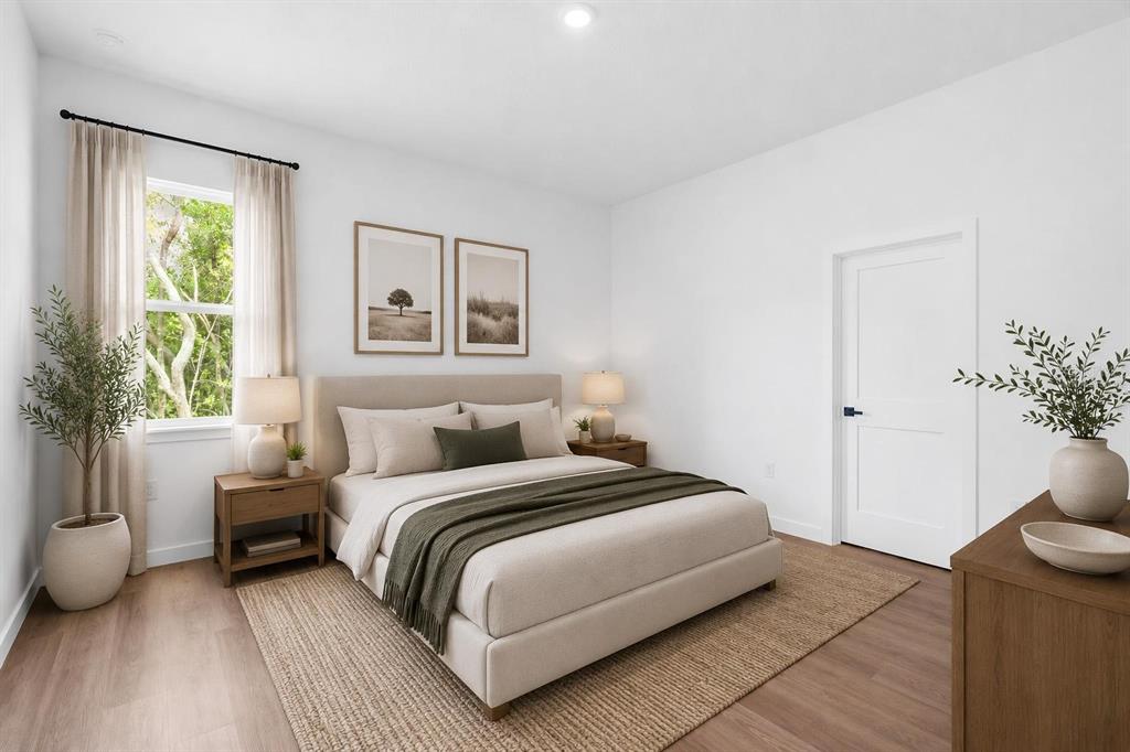 A single-story house with a gray garage, stucco exterior, and a paved driveway — 1318 W DUPONT DRIVE, DUNNELLON, FL