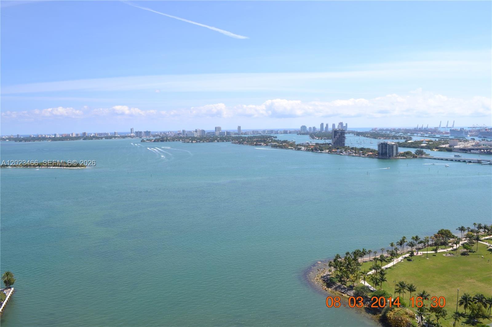 An elevated view shows a large body of water, islands, and distant city skylines — 2020 N Bayshore Dr # 2805, Miami FL 33137, MIAMI, FL