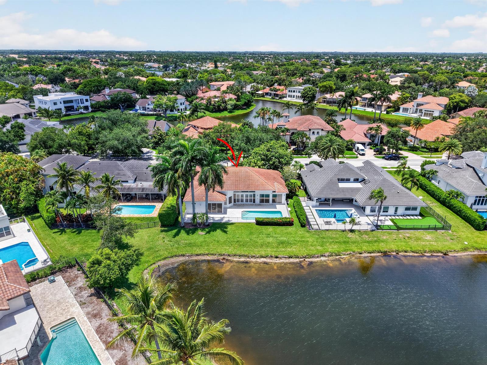 An aerial view shows a residential house with a red-tiled roof and a swimming pool — 5768 Harrington Way, Boca Raton FL 33496, BOCA RATON, FL