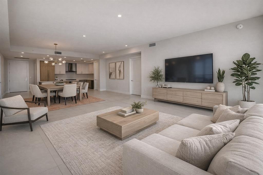 A modern open-concept living and dining area features light wood furniture, neutral decor, and tile flooring — 275 1ST AVENUE UNIT 3807, ST PETERSBURG, FL