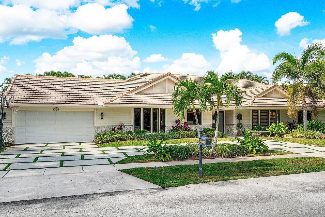 A single-story house with a beige tile roof, white siding, and a paved driveway — 3765 Kings Way, Boca Raton FL 33434, BOCA RATON, FL