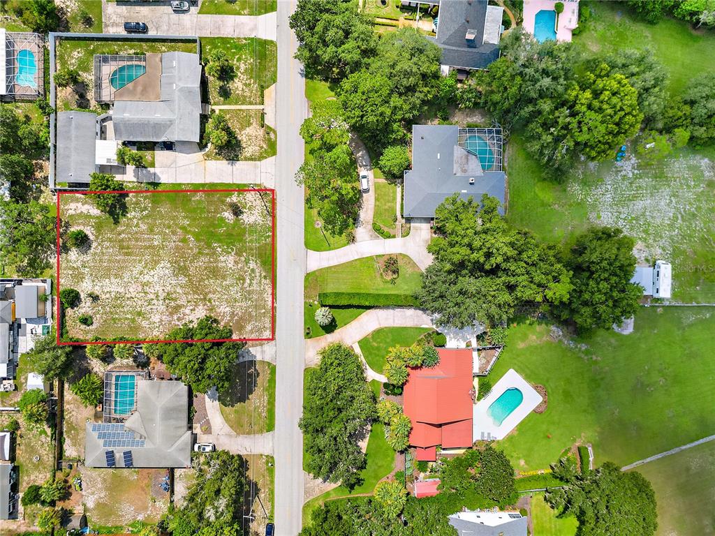 An aerial view shows a vacant, rectangular lot outlined in red along a residential street — 0 LAKESHORE BOULEVARD N, LAKE WALES, FL