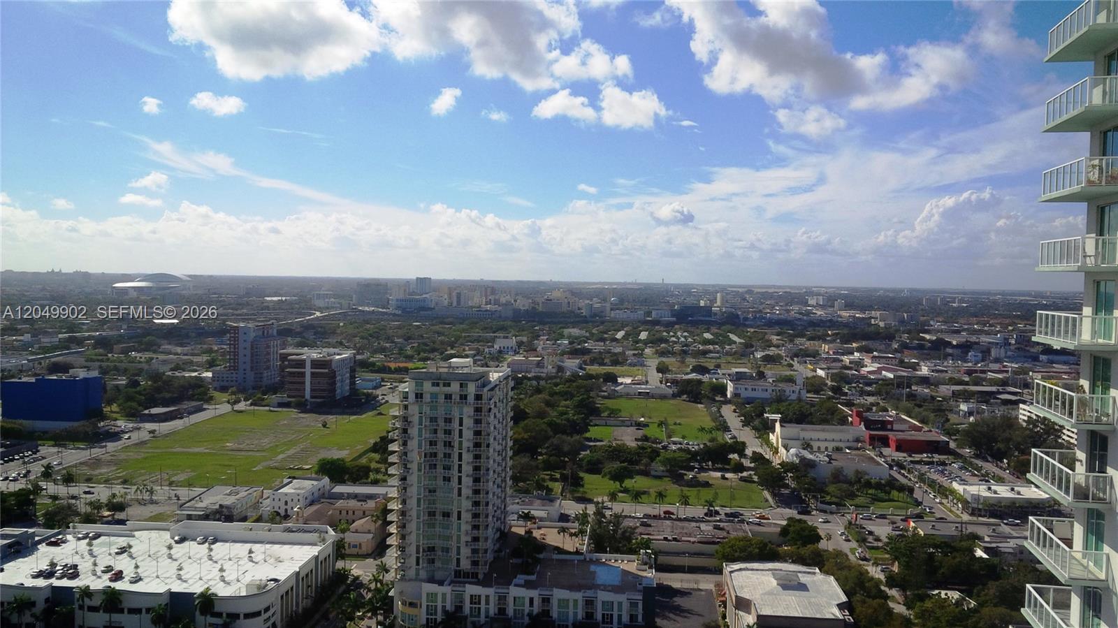 An elevated view shows a city landscape with high-rise buildings and suburban streets — 1800 N Bayshore Dr # 3310, Miami FL 33132, MIAMI, FL