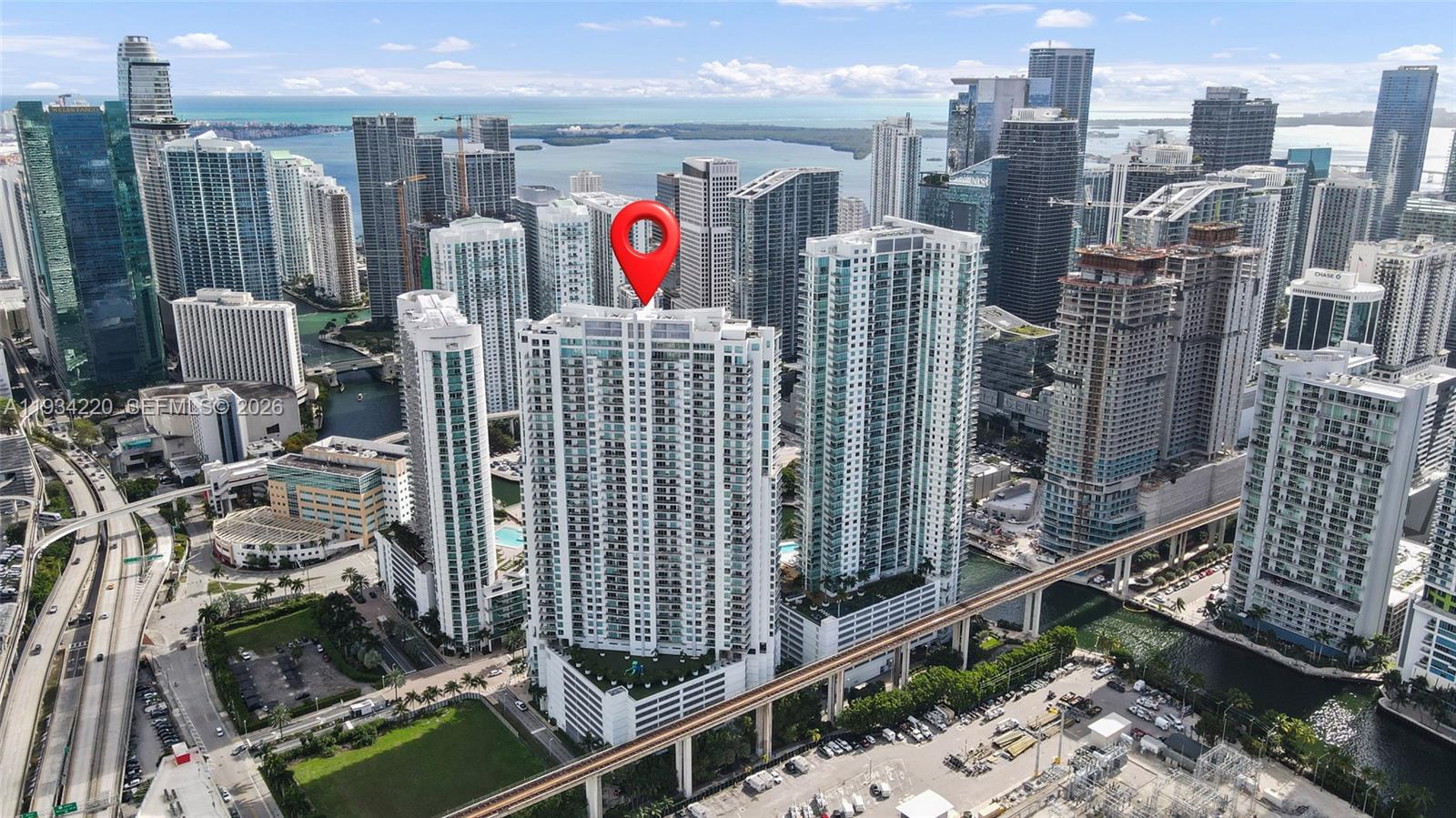 An aerial view of a high-rise residential building in a dense urban city skyline — 90 SW 3rd St # 2109, Miami FL 33130, MIAMI, FL