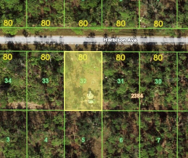 This is an aerial map showing a rectangular lot highlighted in yellow along Harbison Avenue — 13093 HARBISON AVENUE, PORT CHARLOTTE, FL
