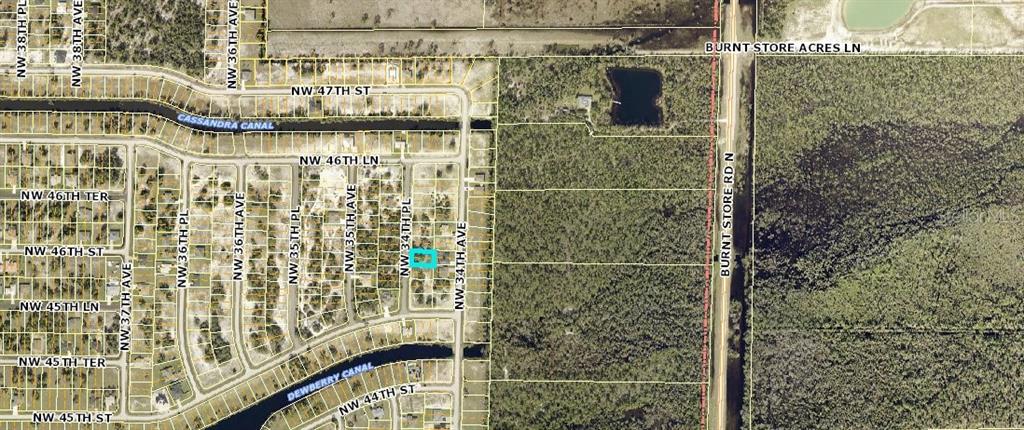 This is an aerial map showing a residential lot highlighted in blue within a neighborhood — 4513 NW 34TH PLACE, CAPE CORAL, FL
