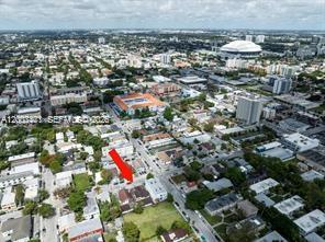 An aerial view shows a residential neighborhood with a red arrow pointing to a building — 315 SW 10th Ave, Miami FL 33130, MIAMI, FL