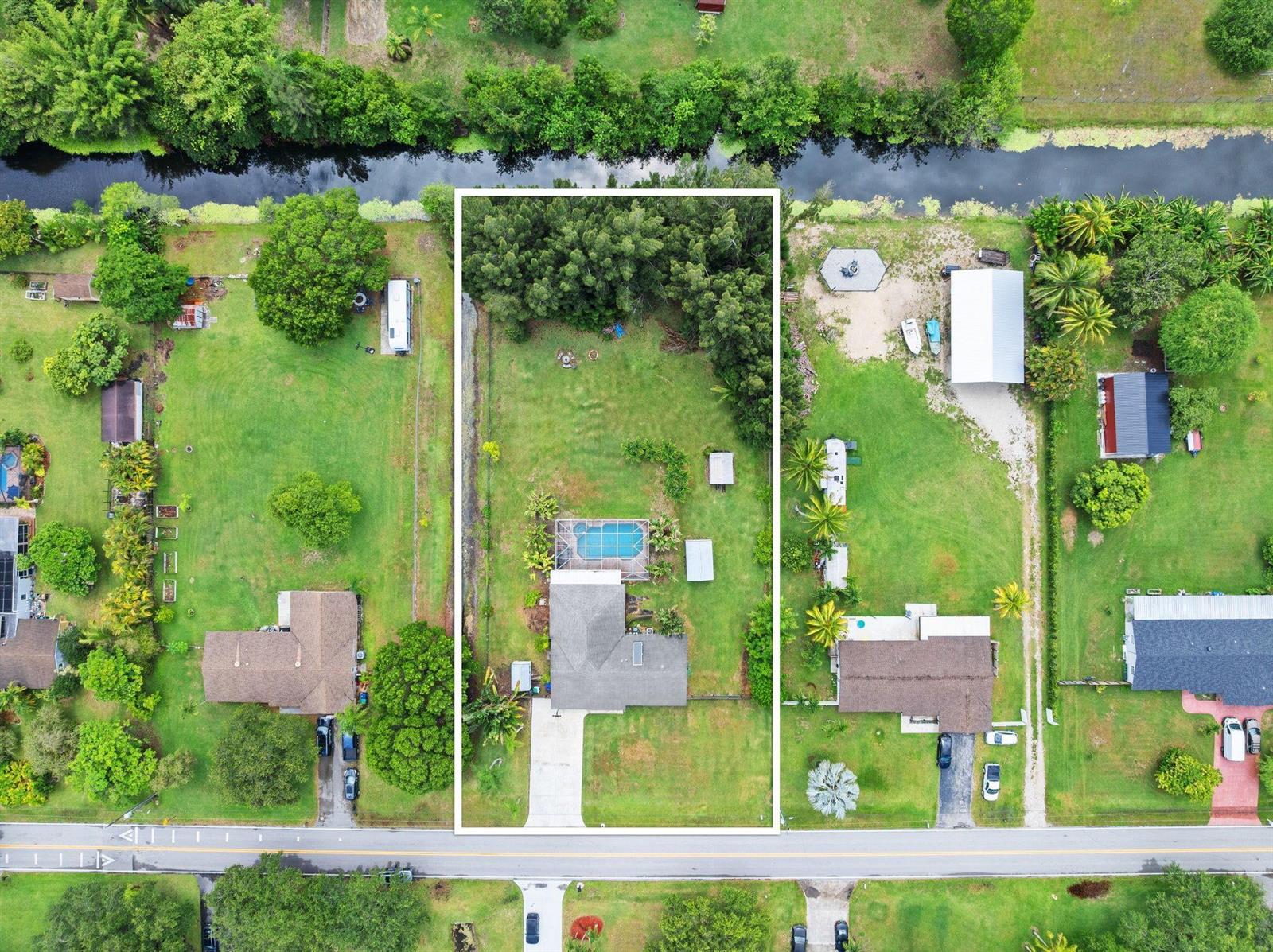An aerial view shows a single-family home with a pool on a large, rectangular lot — 5191 SW 188th Avenue, Southwest Ranches FL 33332, SOUTHWEST RANCHES, FL