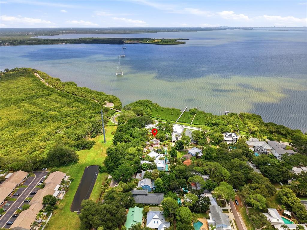 An aerial view shows a residential neighborhood nestled along a large body of water — Lot 14 E MARSHALL STREET, SAFETY HARBOR, FL