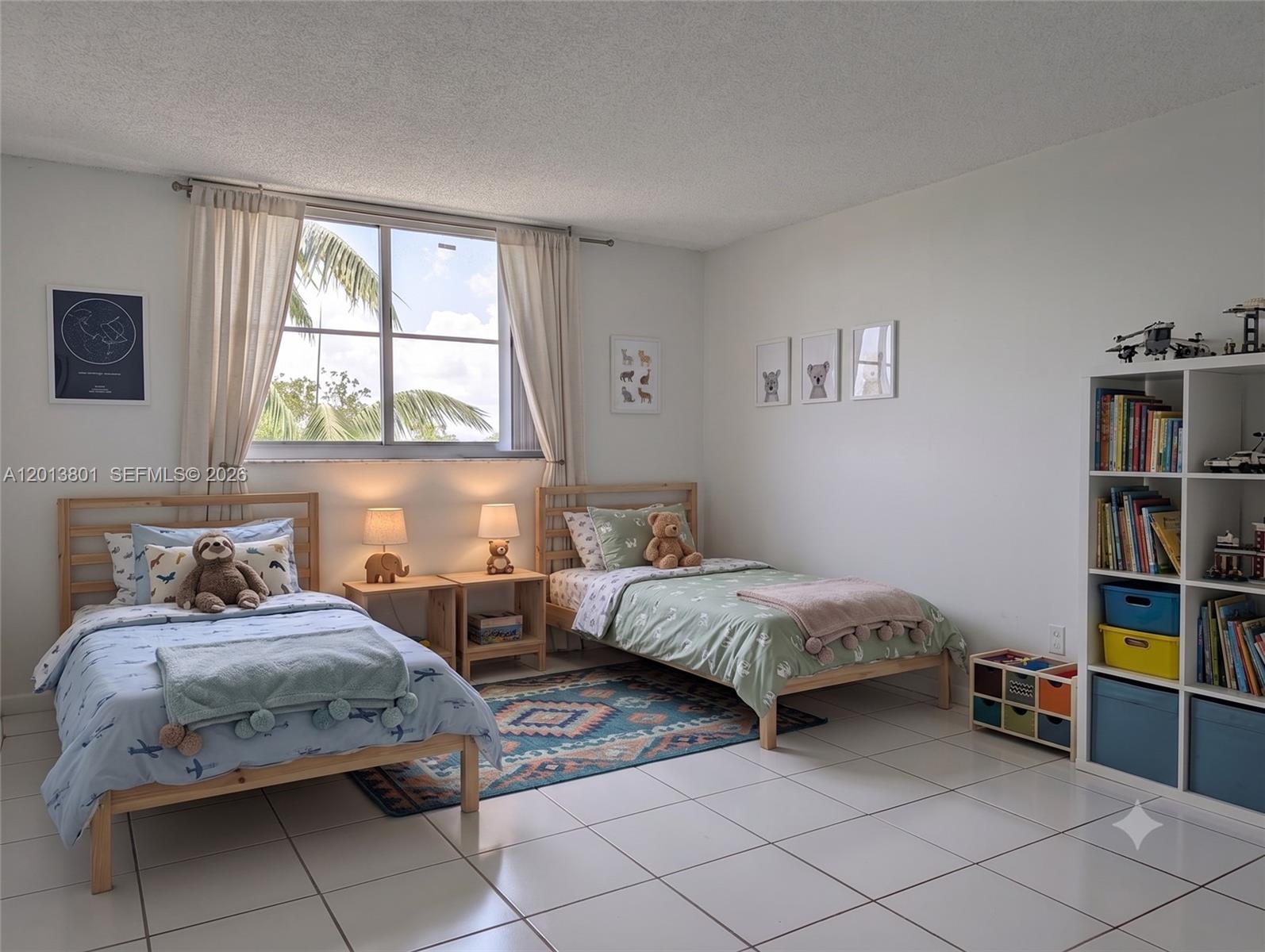 A children's bedroom features two twin beds, a bookshelf, and tile flooring — 210 Sea View Dr # 405, Key Biscayne FL 33149, KEY BISCAYNE, FL