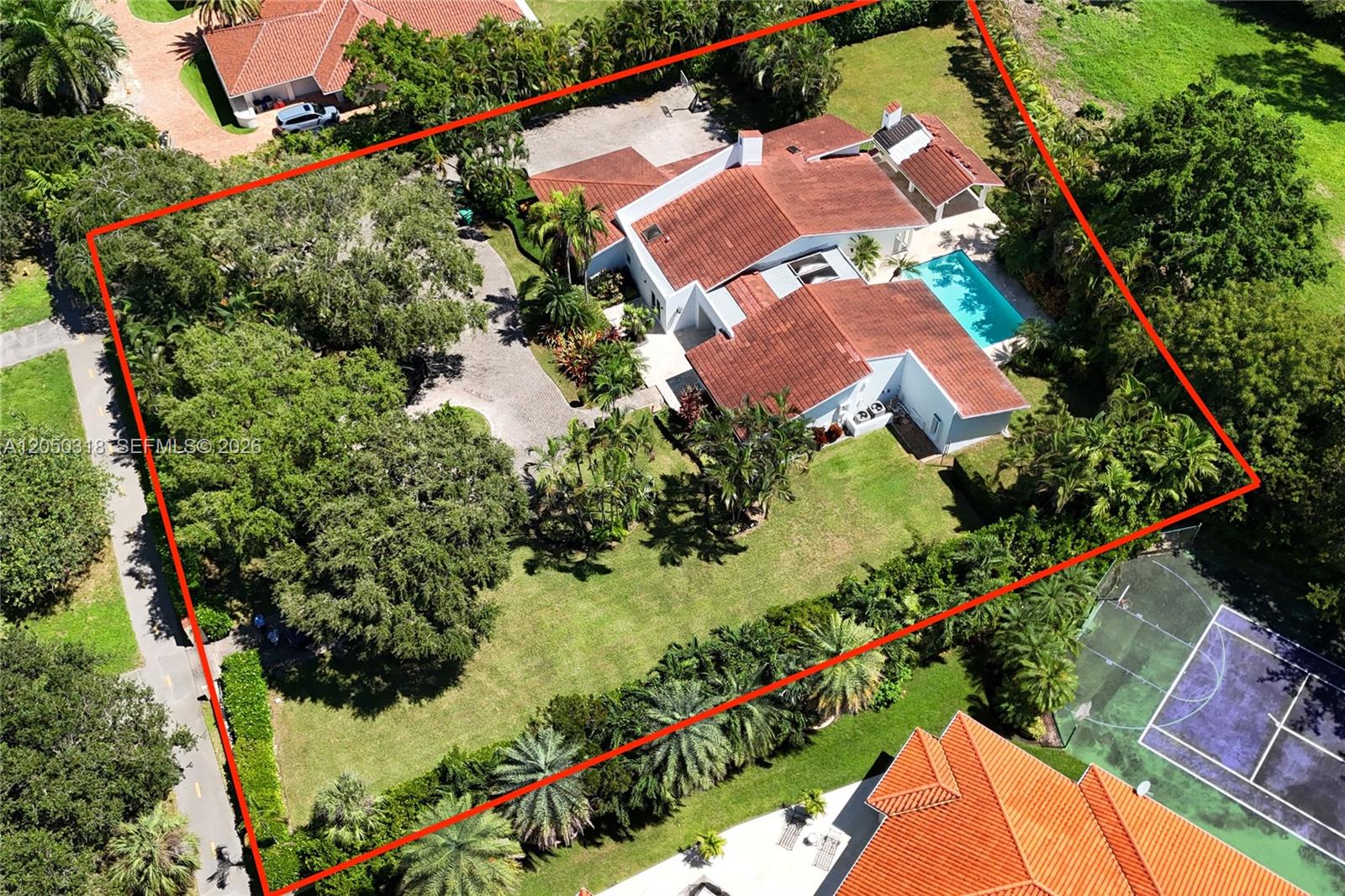 An aerial view shows a house with a red tile roof, pool, and large yard — 8303 Old Cutler Rd, Coral Gables FL 33143, CORAL GABLES, FL