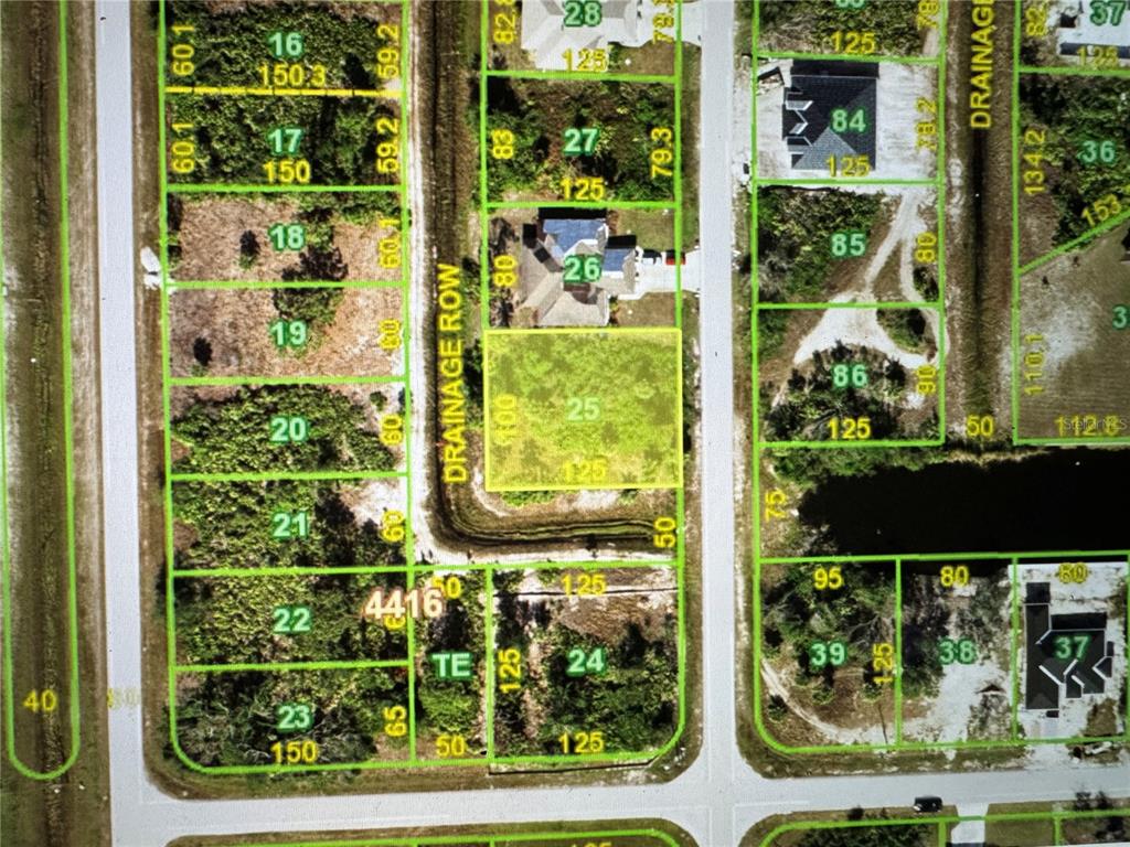 This is a plat map showing residential lot boundaries and drainage areas — 9357 AGATE STREET, PORT CHARLOTTE, FL