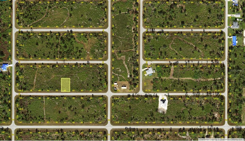 This is an aerial map showing a vacant residential lot highlighted in yellow — 12084 BEIMAN AVENUE, PORT CHARLOTTE, FL