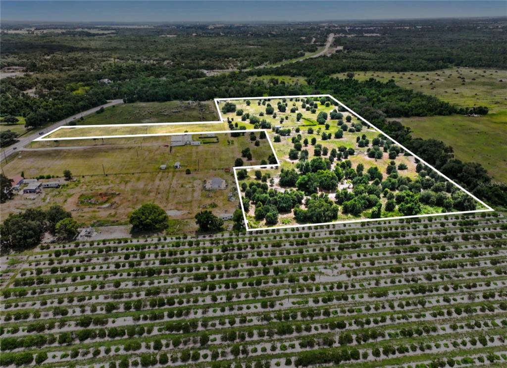 An aerial view shows a large, irregularly shaped plot of land outlined in white — NW 70 HIGHWAY NW, ARCADIA, FL