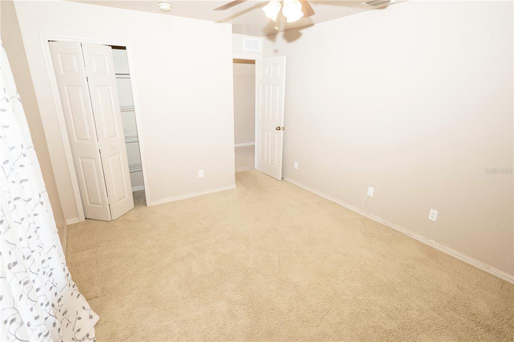 A kitchen with light wood cabinets, stainless steel appliances, and a tile floor — 4129 NE 19TH PLACE, CAPE CORAL, FL