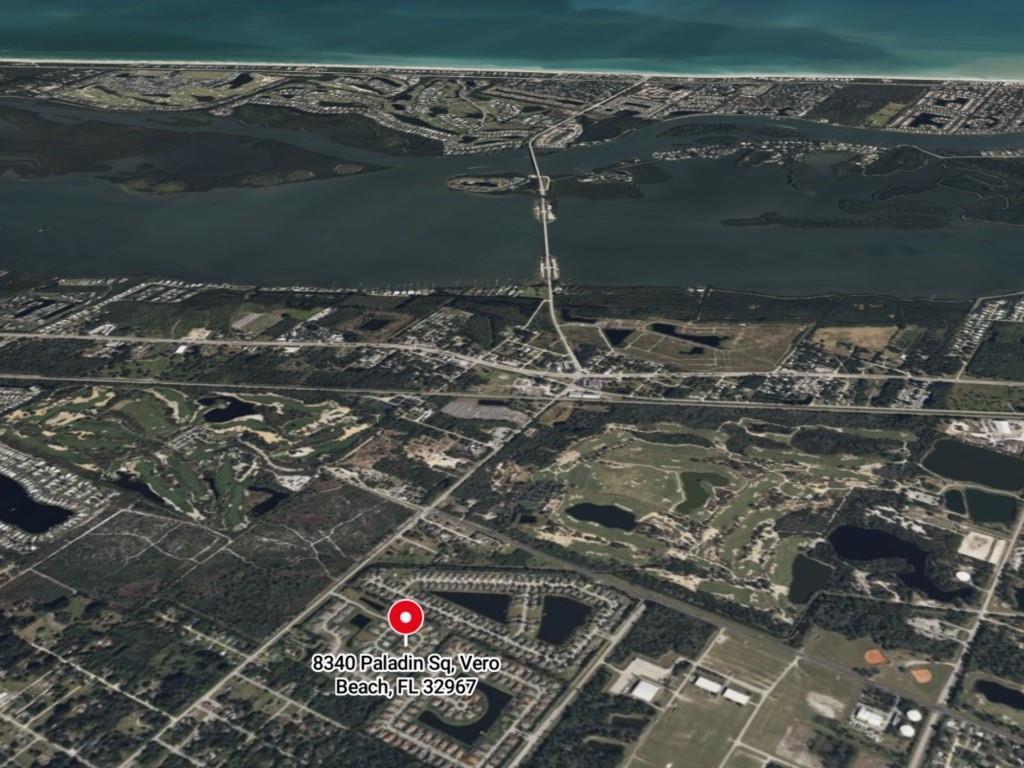 An aerial view of a residential neighborhood and surrounding landscape in Vero Beach, Florida — 8340 Paladin Square, Vero Beach FL 32967, VERO BEACH, FL
