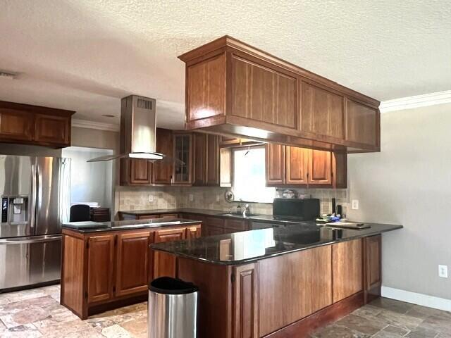 A kitchen features dark wood cabinets, a granite island, and a stainless steel range hood — 36911 3rd Street, Canal Point FL 33438, CANAL POINT, FL