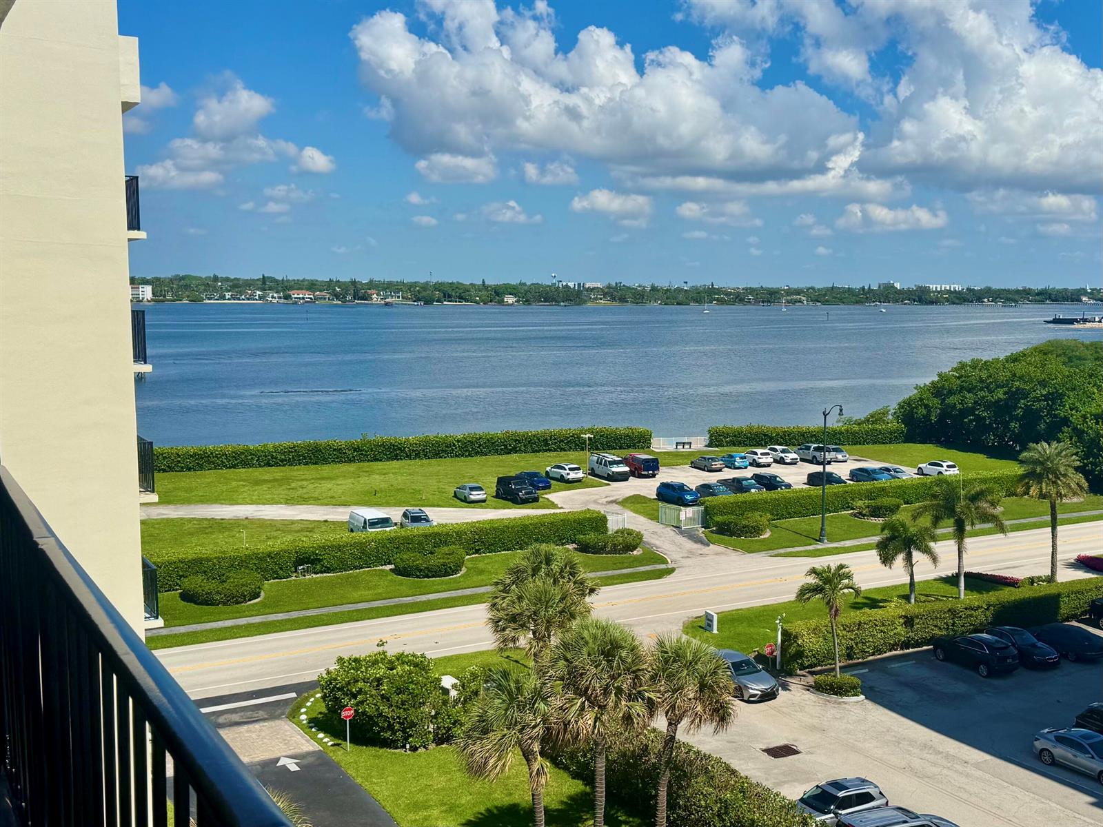 An elevated view of a parking lot, a road, and a large body of water — 3460 S Ocean Boulevard # 612, Palm Beach FL 33480, PALM BEACH, FL