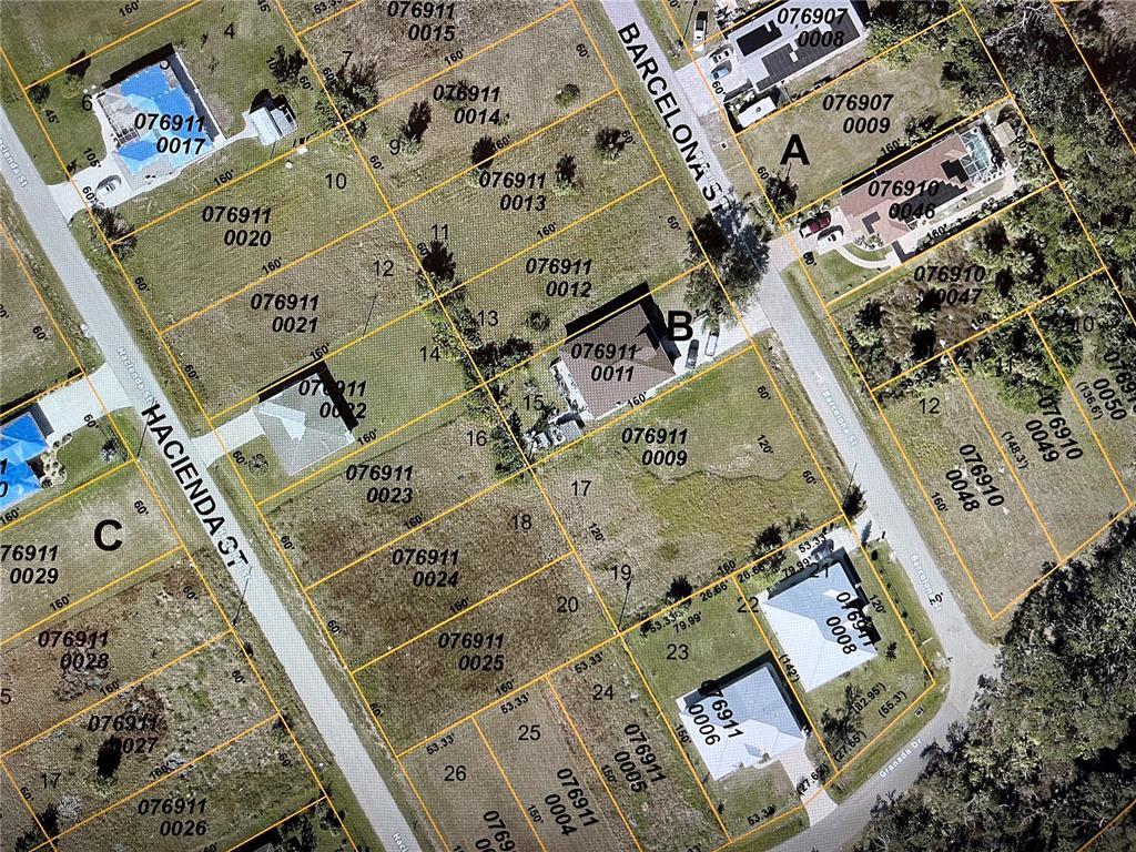 This is an aerial map showing residential lots and streets in a neighborhood — LOT 13 BARCELONA STREET, NORTH PORT, FL