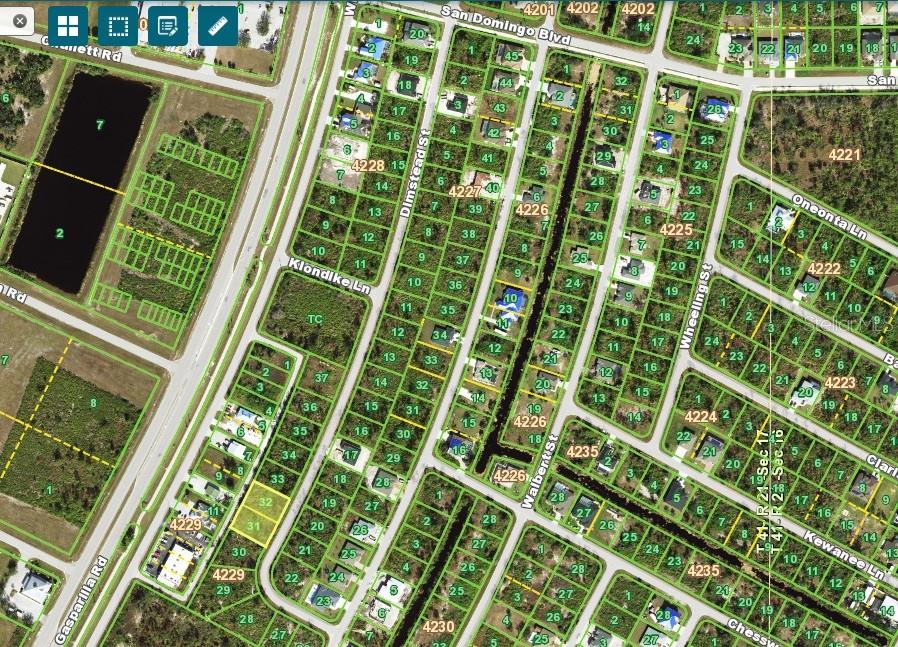 This is a satellite map view of a residential neighborhood with houses and streets — 8281 DIMSTEAD ST., PORT CHARLOTTE, FL