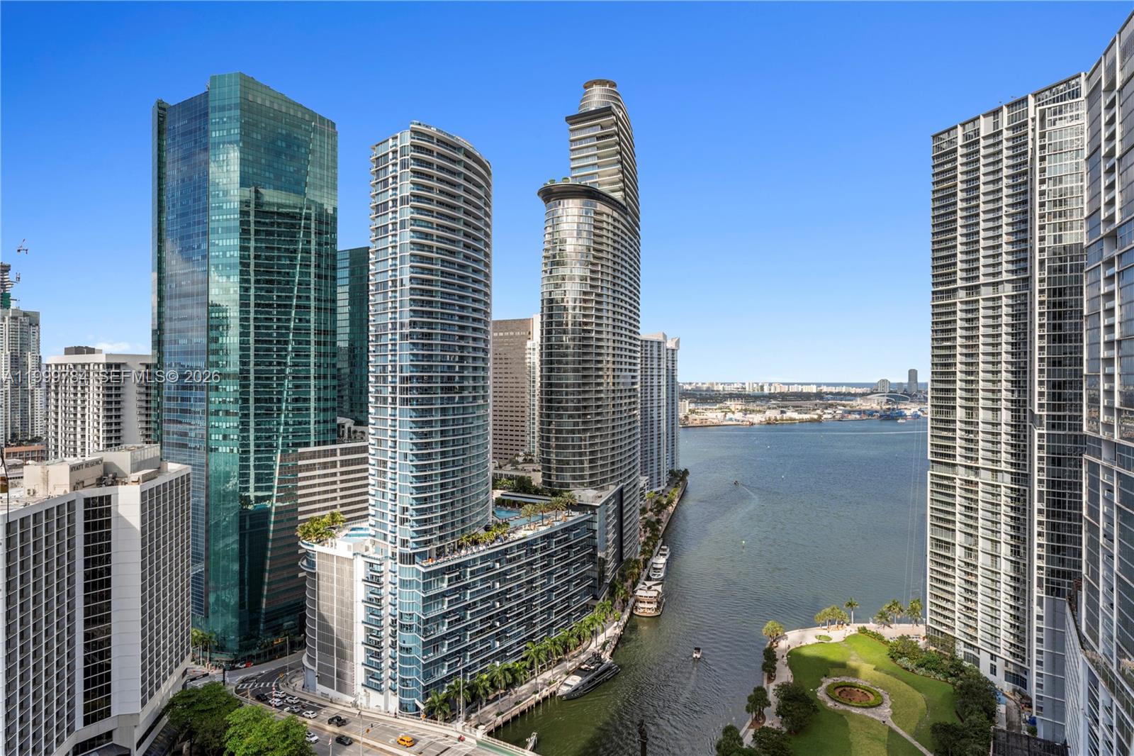 An elevated view of high-rise buildings along a riverfront in a city — 77 SE 5th Street # 3304, Miami FL 33131, MIAMI, FL
